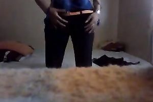 Slender legal age teenager disrobes in front of a web camera and plays with her lovely cum-hole