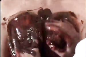 Chocolate fetish scene with a titjob and passionate sex