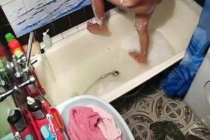 Hot honey takes bathroom and rubs her freshly hairless pussy