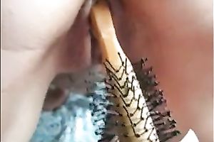 Tight wife stuffs a hairbrush in her bald poontang