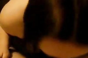 Chubby dark brown sucks and titfucks a dick in POV movie