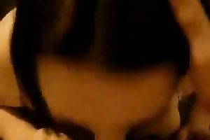 Chubby dark brown sucks and titfucks a dick in POV movie