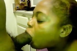 Ebony woman gives great head to her recent ally in the kitchen