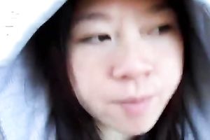 Asian beauty blowing chunky jock outside