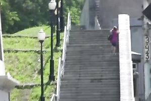Redhead slut pees in her pants on a bridge in void urine fetish solo