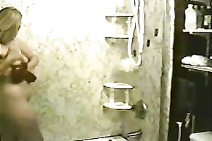 Fat and breasty white hottie taking shower and masturbates