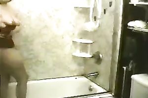 Fat and breasty white hottie taking shower and masturbates