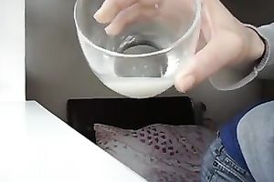 She sucks on her own nipps and milks out a half cup