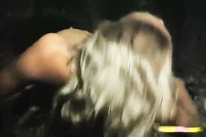 Stunning and diminutive blond women on their knees feeding on a 10-Pounder