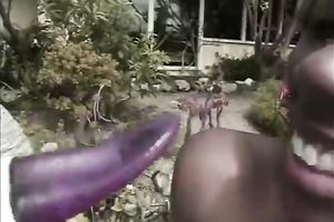 Black lesbian bitch copulates her breasty partner with dong outdoors