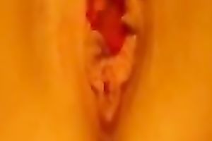 A very marvelous hairless sweetheart love tunnel fitting a sextoy inside