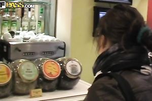 Russian pair Ksenia and Alex walk outside eating ice cock juice