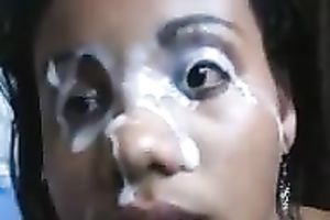 Black girl's gorgeous face is all overspread in manly juice