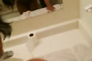 Strong tall dark stud polishes moist pussy of curvy Indian honey in water closet