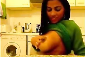 Seductive Indian beauty exposes her big milk sacks and smiles