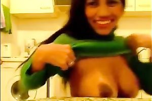 Seductive Indian beauty exposes her big milk sacks and smiles