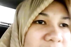 She solely pretends to be a conservative wife in scarf