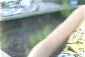 Shameless blonde girlfriend bonks herself with large sex-toy on the rail ways