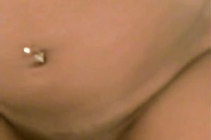 Black young wench handles tiny white knob on the daybed