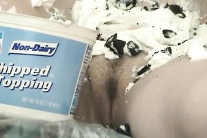 Wacky housewife Danni smears ice-cream and chocolate all over her bust