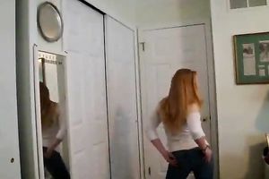 Skanky redhead gives non-professional striptease show on the livecam