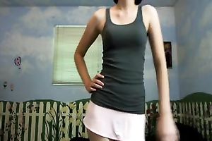 Amateur brunette hair wearing a miniskirt shows her cleavage for the webcam