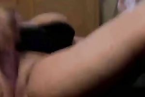 Bosomy whore lies on her back and masturbates with a sex toy