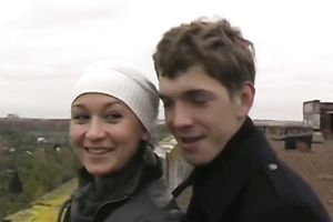 Amateur Russian pair having a walk outdoors on cold day