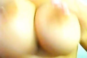 Bootylicious kinky black haired wench sucked her heavy breasts