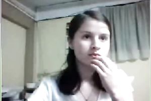 Pretty dark brown hottie with merry bumpers flashes her hairy love tunnel on livecam