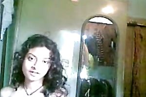 Cute shaggy haired Desi gal flashed her meatballs during the time that stripping on camera