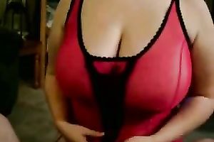 Busty big beautiful woman in mask and corset sucks knob greedily