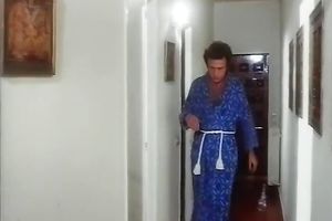 Beautiful brunette playgirl gives head to her paramour in arousing retro sex episode