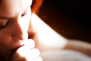 Spectacular redhead white beauty with flower in her hair blows jock