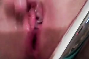 Closeup of my own wife sweet her pink wet crack with a metal fake penis