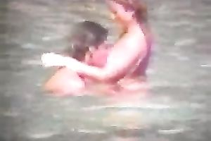 Sexy pair of blonde people getting horny and cuddly on the beach