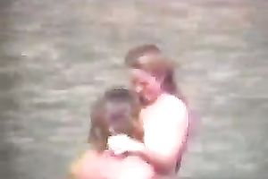 Sexy pair of blonde people getting horny and cuddly on the beach