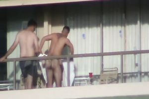 Spy clip of beefy muscular guy fucking excited black cock sluts on a balcony