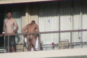 Spy clip of beefy muscular guy fucking excited black cock sluts on a balcony