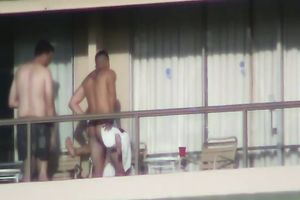 Spy clip of beefy muscular guy fucking excited black cock sluts on a balcony