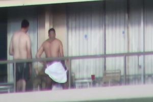 Spy clip of beefy muscular guy fucking excited black cock sluts on a balcony
