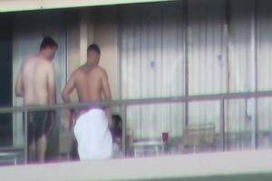 Spy clip of beefy muscular guy fucking excited black cock sluts on a balcony
