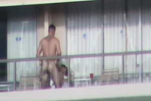 Spy clip of beefy muscular guy fucking excited black cock sluts on a balcony
