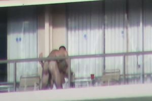 Spy clip of beefy muscular guy fucking excited black cock sluts on a balcony