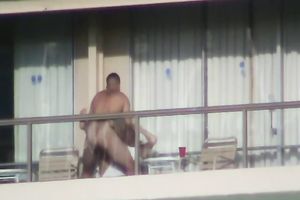 Spy clip of beefy muscular guy fucking excited black cock sluts on a balcony