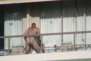 Spy clip of beefy muscular guy fucking excited black cock sluts on a balcony