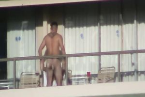 Spy clip of beefy muscular guy fucking excited black cock sluts on a balcony