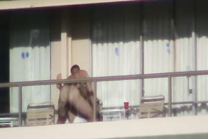 Spy clip of beefy muscular guy fucking excited black cock sluts on a balcony