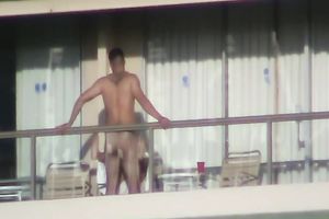 Spy clip of beefy muscular guy fucking excited black cock sluts on a balcony