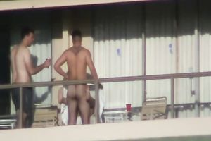 Spy clip of beefy muscular guy fucking excited black cock sluts on a balcony